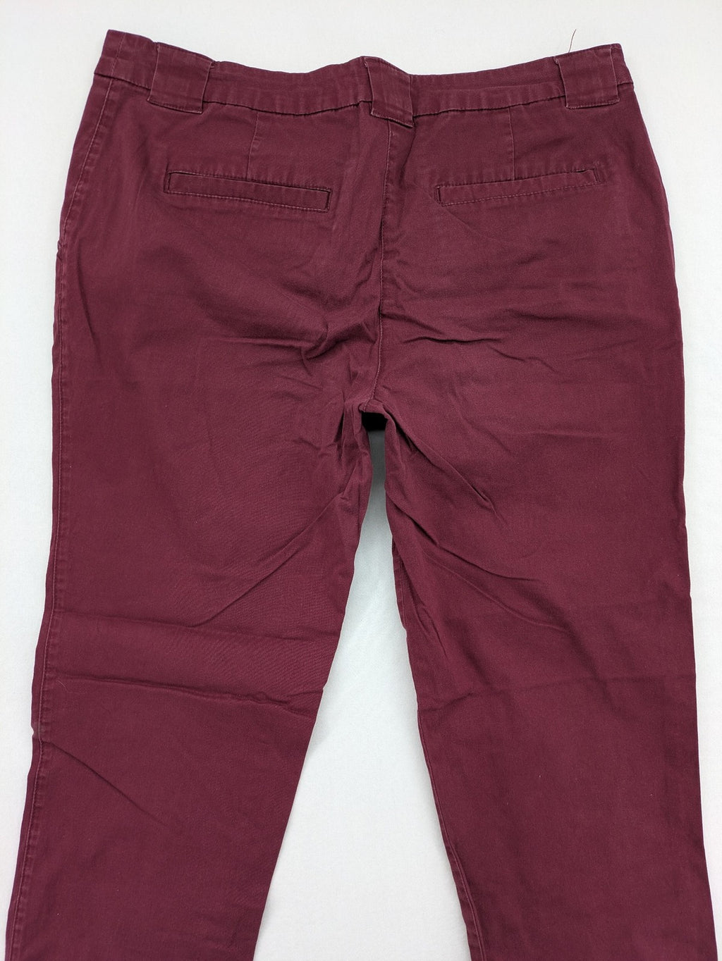 BPC Bonprix burgundy chino pants with front pleats and floral pocket lining.