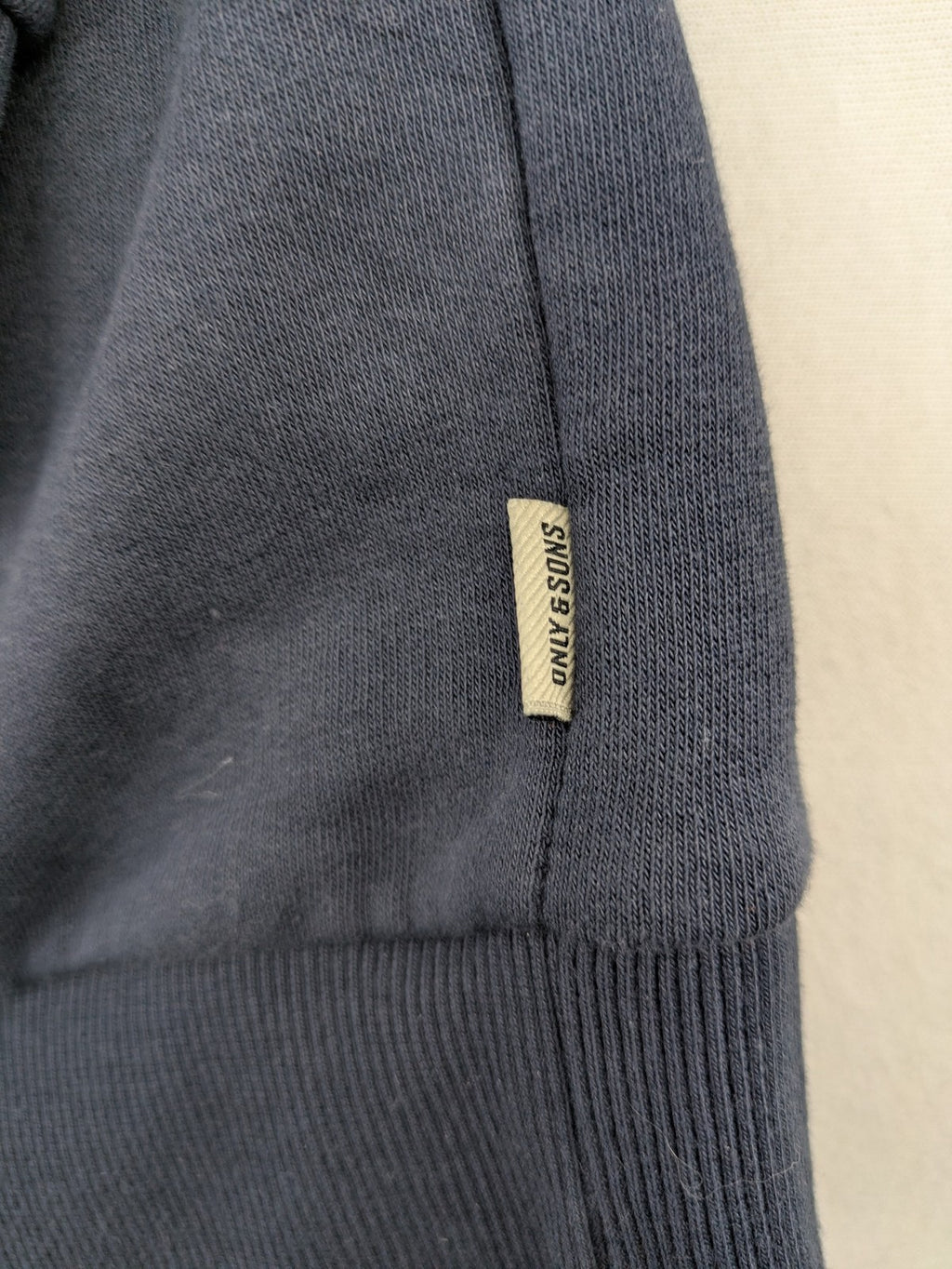 G-Unit navy turtle neck jumper with vertical logo graphic and soft fleece interior.