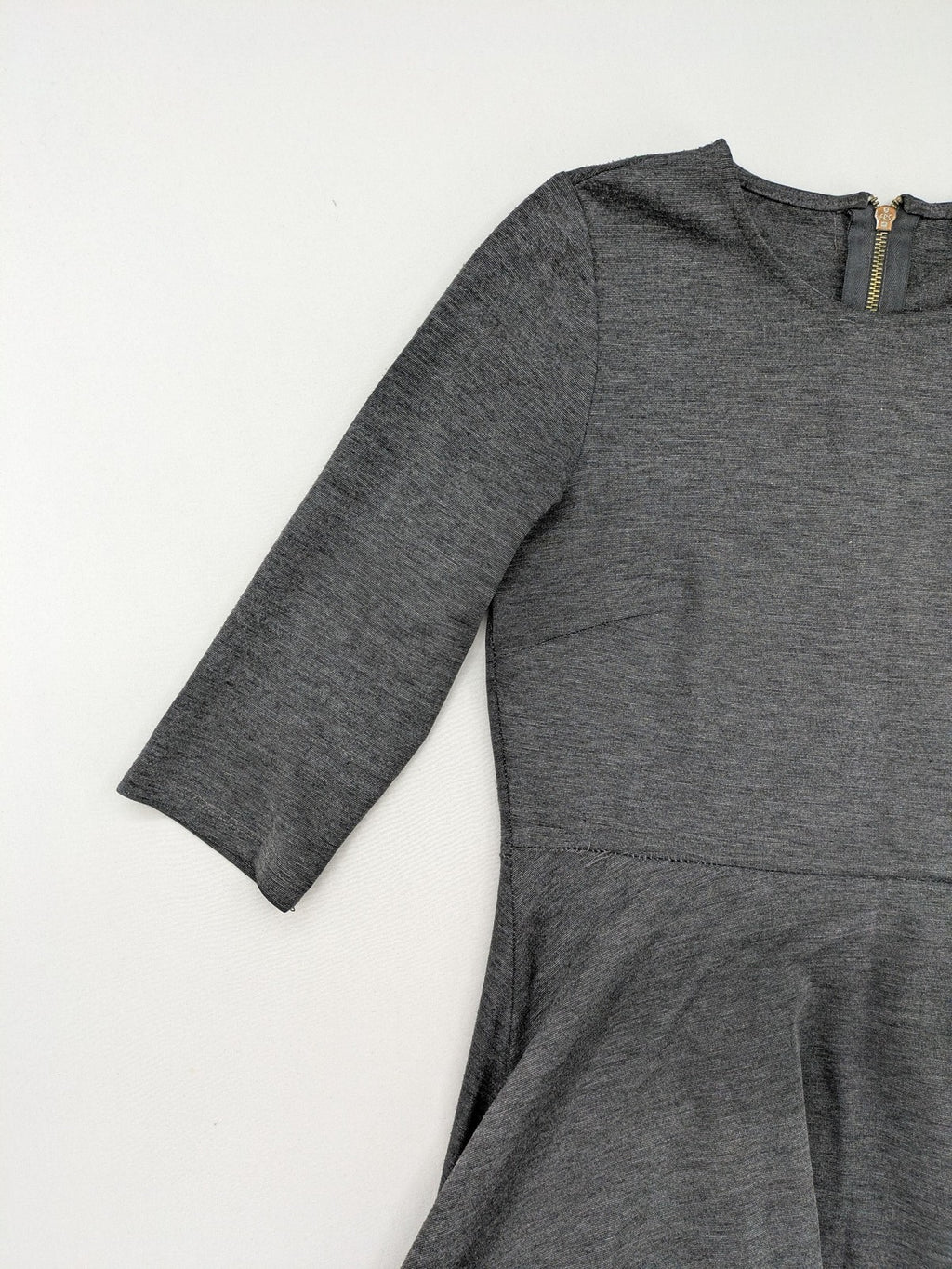 Ginatricot grey A-line skater dress with 3/4 sleeves and visible back zipper.