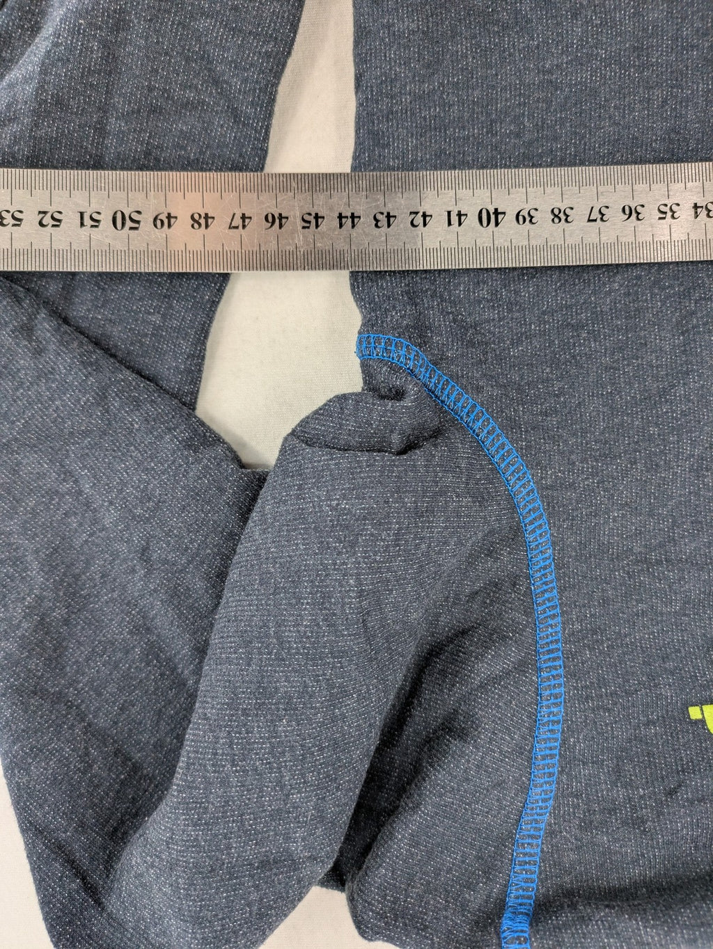 Bench hoodie dark grey with neon green logo and blue contrast stitching.