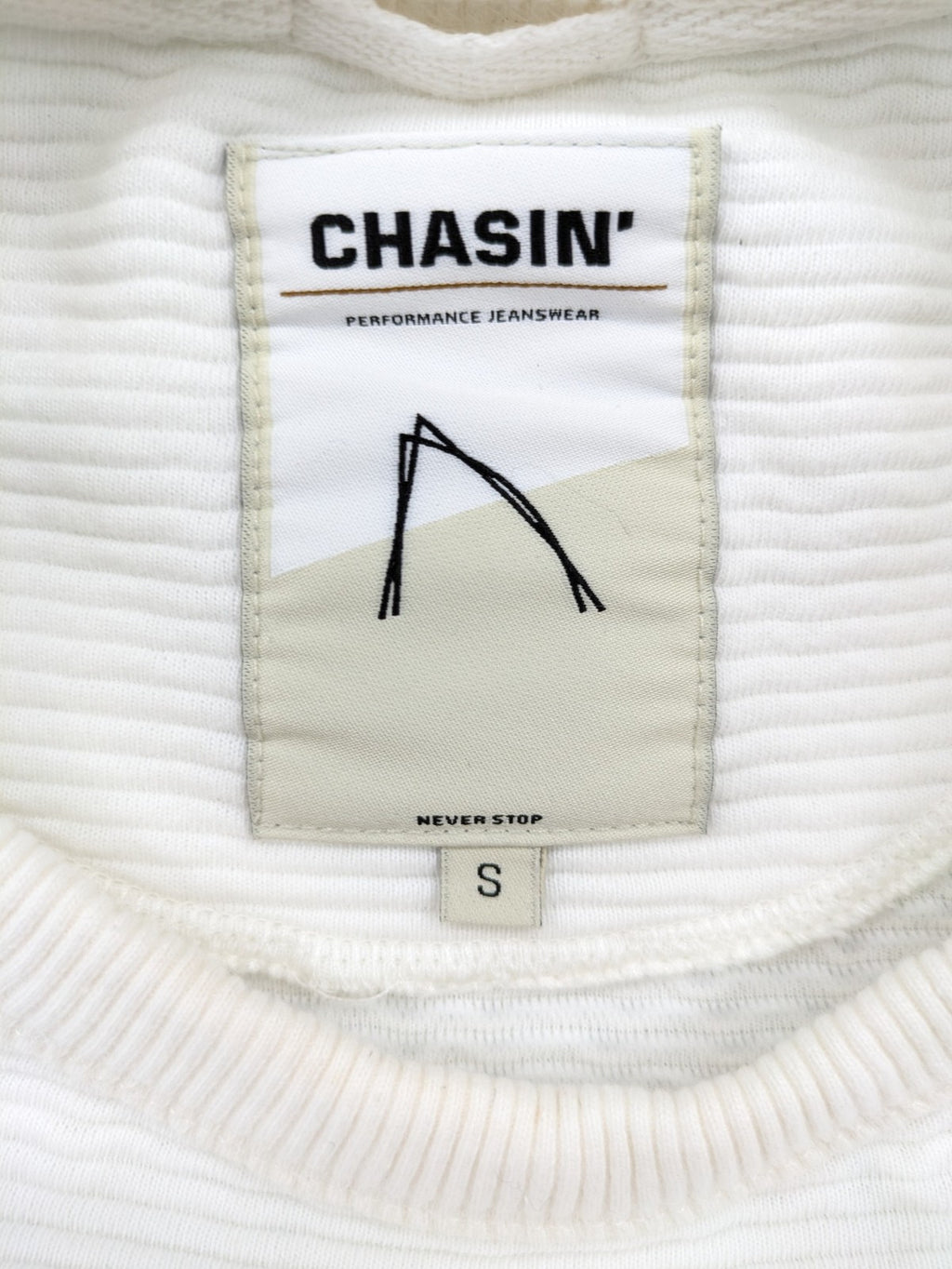 CHASIN' grey and white turtle neck jumper with horizontal ribbed texture and logo patch.