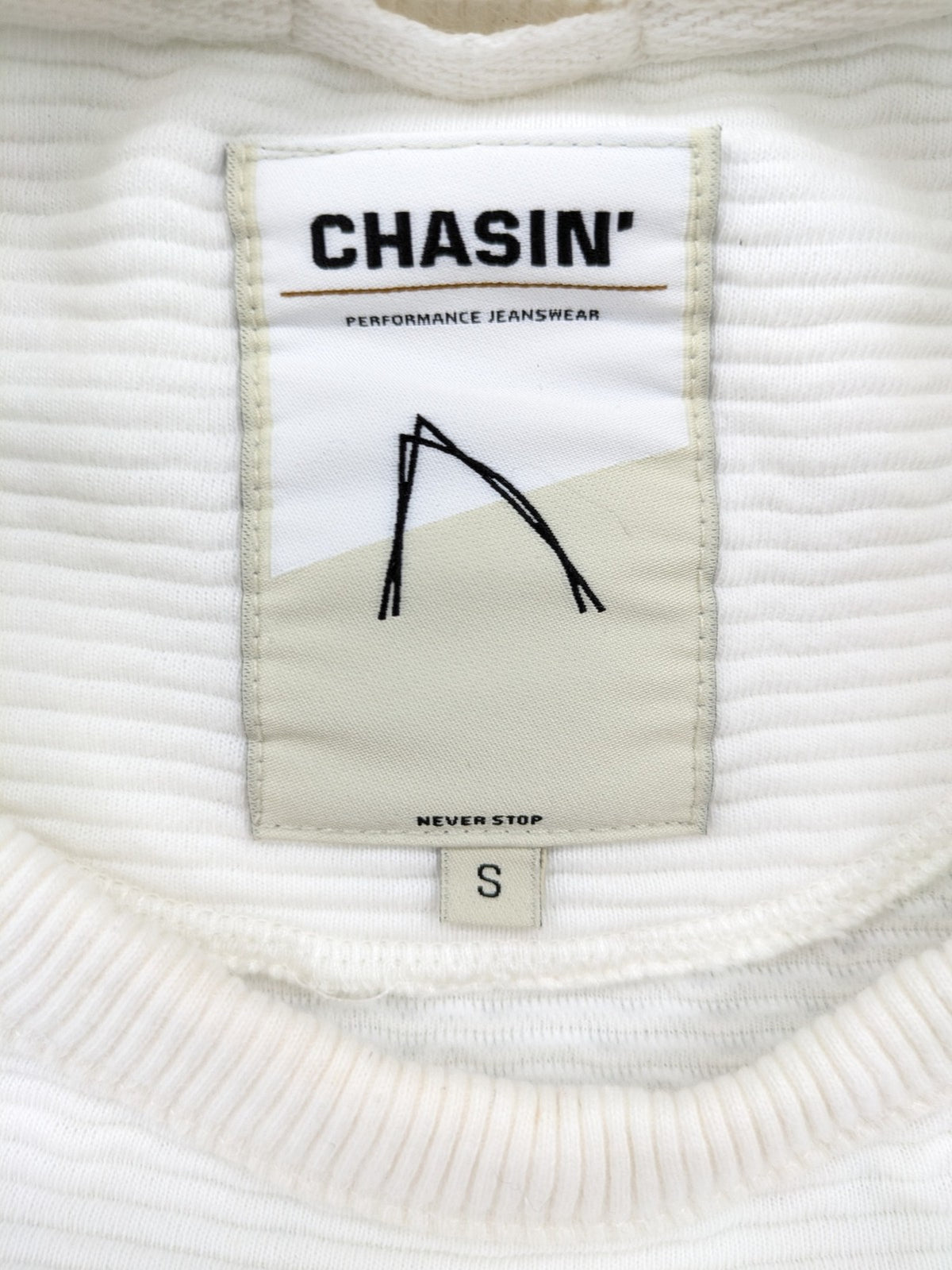 CHASIN' grey and white turtle neck jumper with horizontal ribbed texture and logo patch.