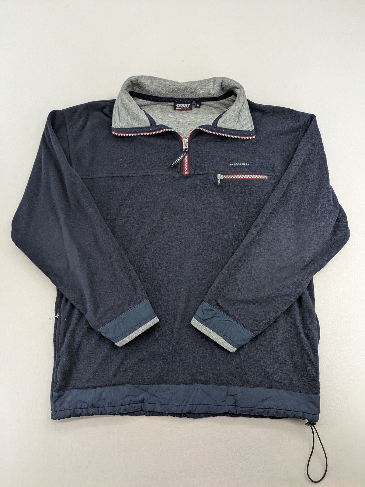 Sport Division turtle neck jumper dark blue fleece with quarter zip and chest pocket.