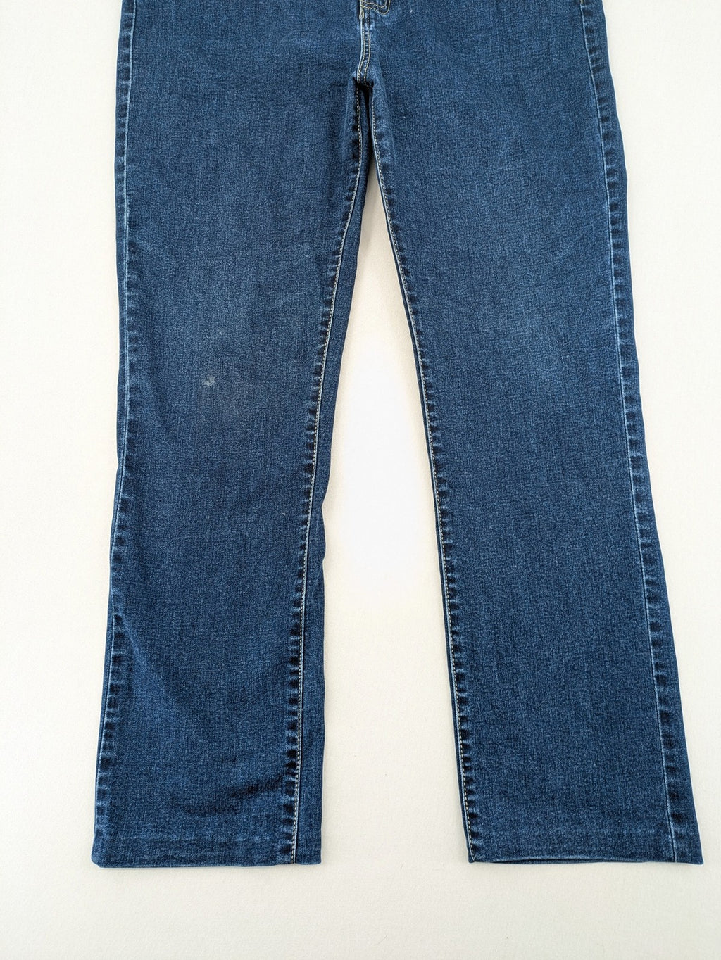 Miss Good blue straight jeans with 5-pocket design and decorative metal accent.