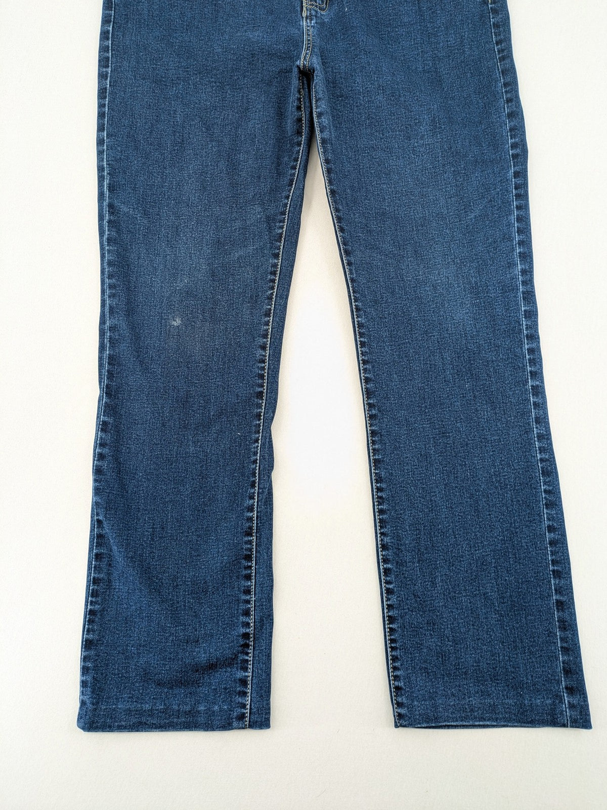 Miss Good blue straight jeans with 5-pocket design and decorative metal accent.