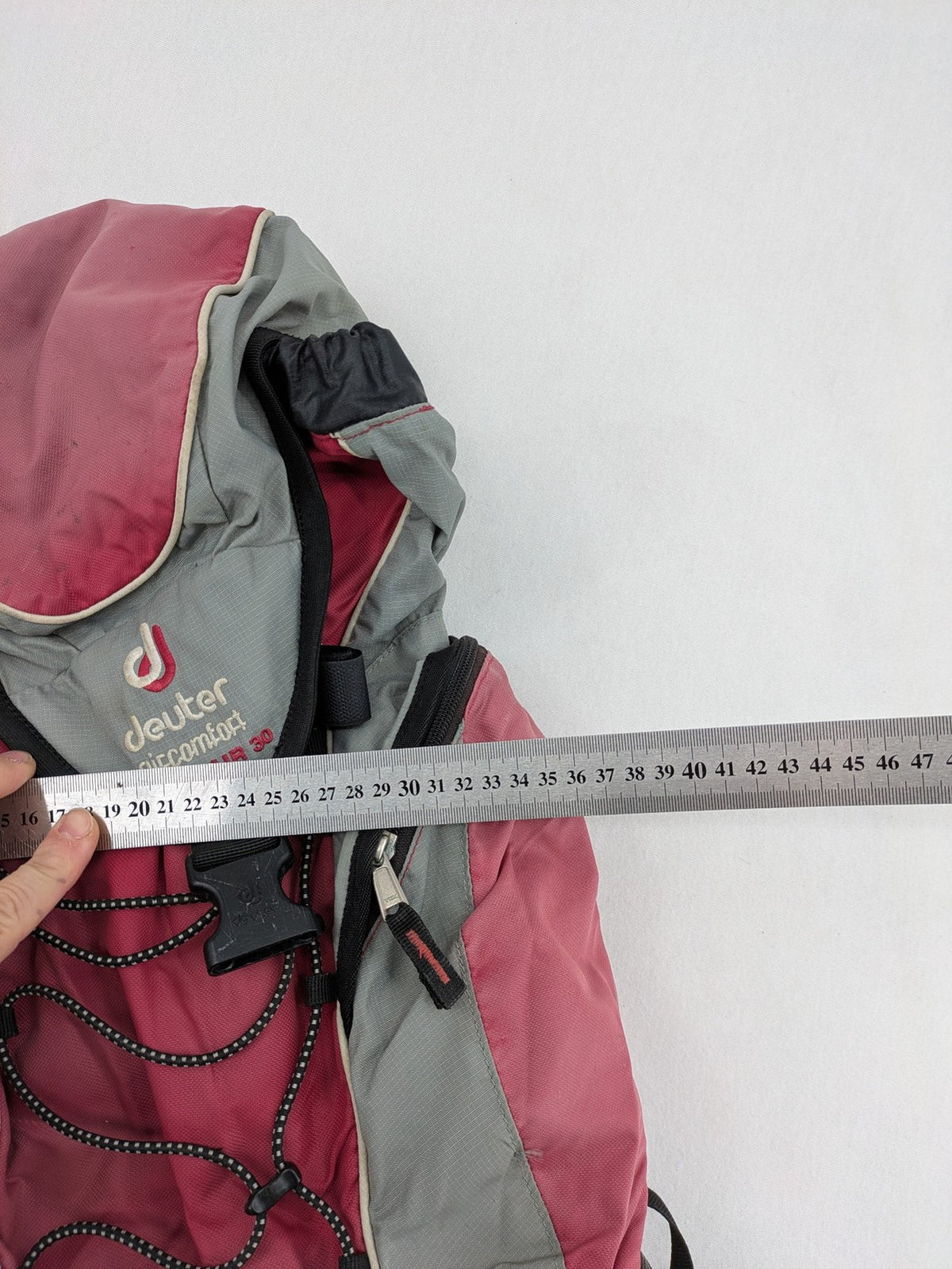 Deuter grey and pink Aircomfort Walk Air 30 rucksack with mesh back system.
