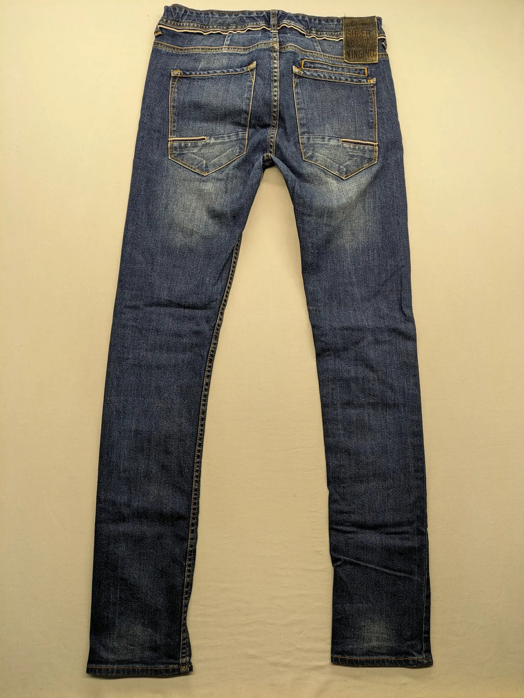 Vingino blue straight jeans medium wash 5-pocket design with zipper fly and stretch denim.