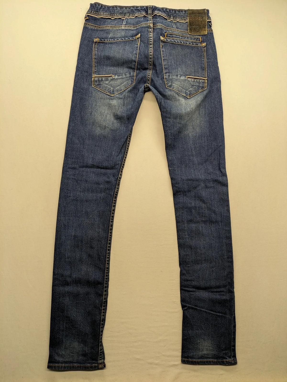 Vingino blue straight jeans medium wash 5-pocket design with zipper fly and stretch denim.