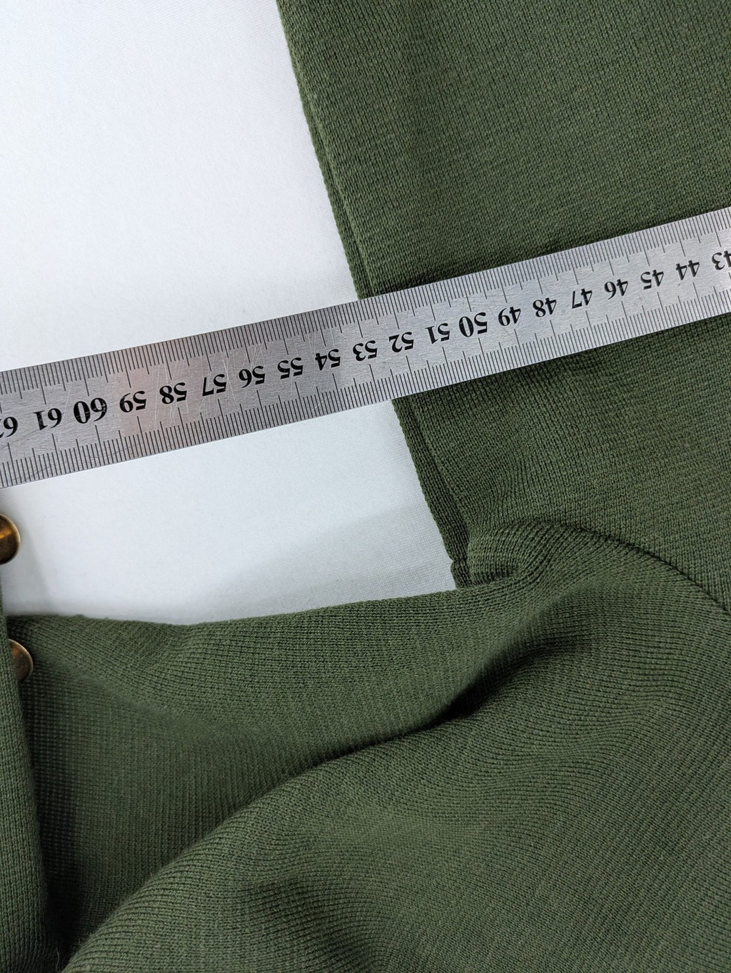 LUCIA green Trachtenjacke with embroidered crest, quilted collar, and decorative buttons.