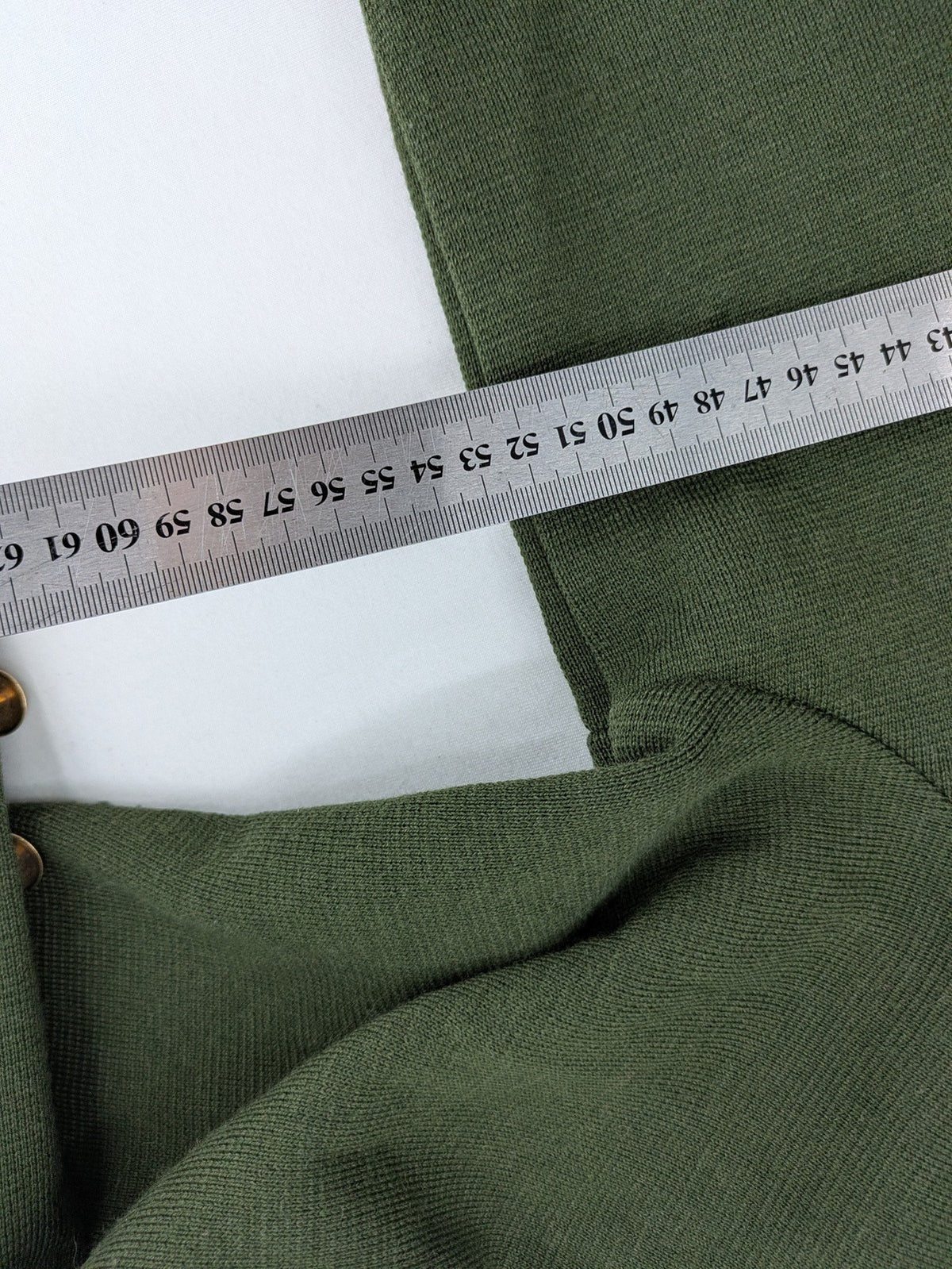 LUCIA green Trachtenjacke with embroidered crest, quilted collar, and decorative buttons.