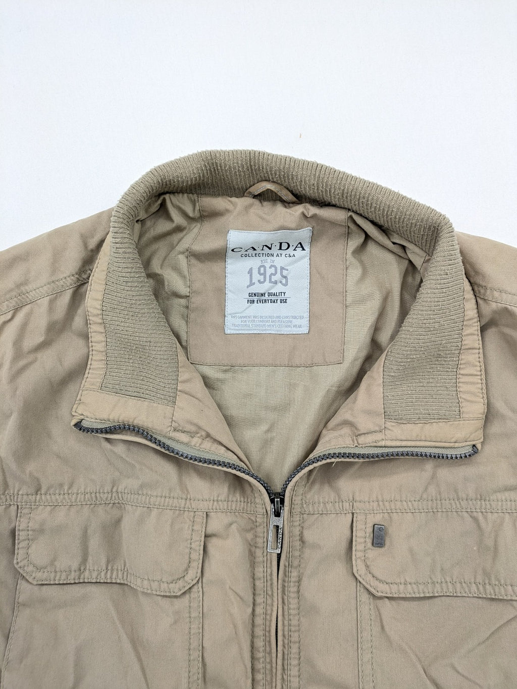 Canda beige bomber jacket full zip with ribbed collar and buttoned chest pockets.