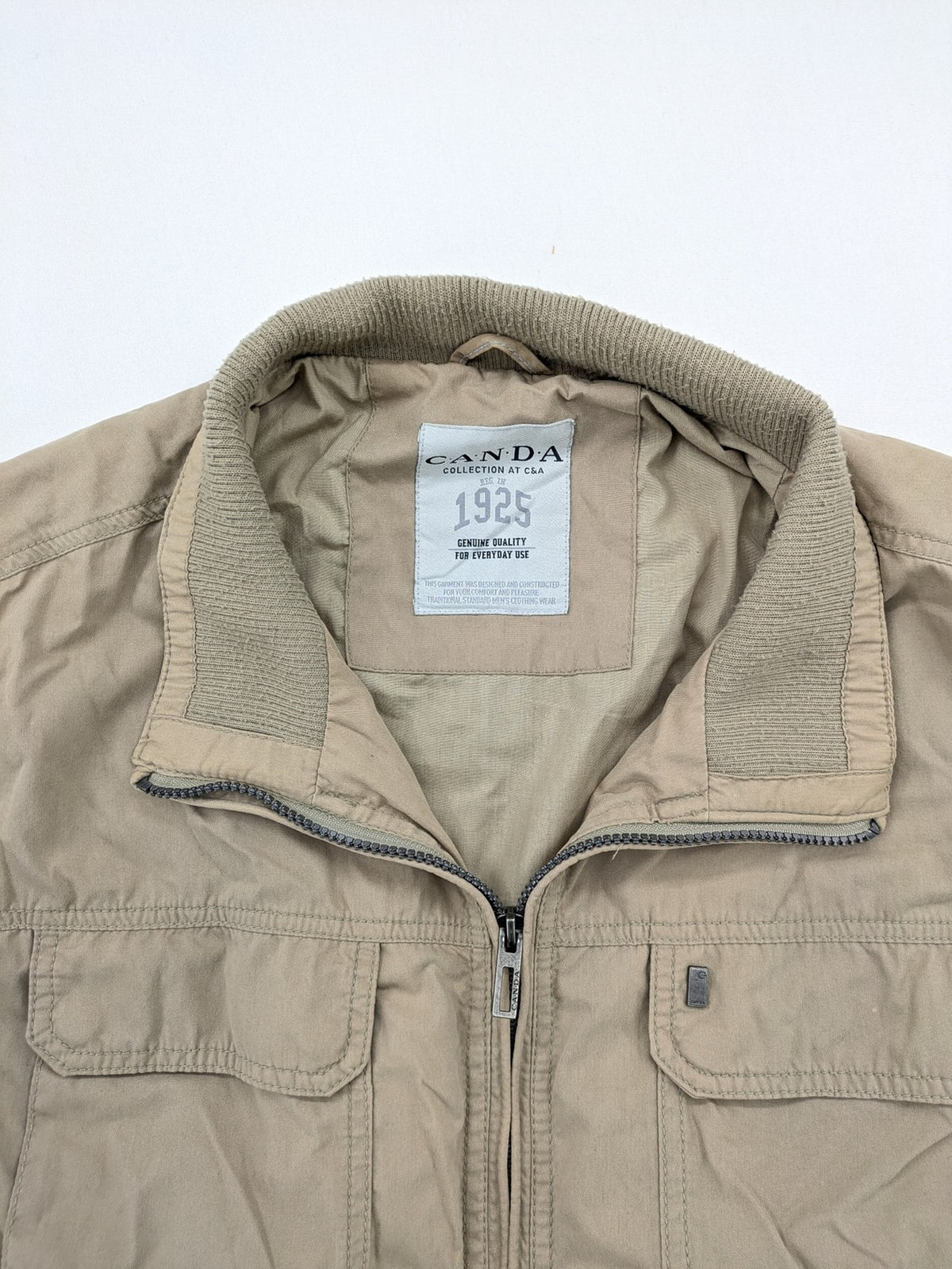 Canda beige bomber jacket full zip with ribbed collar and buttoned chest pockets.