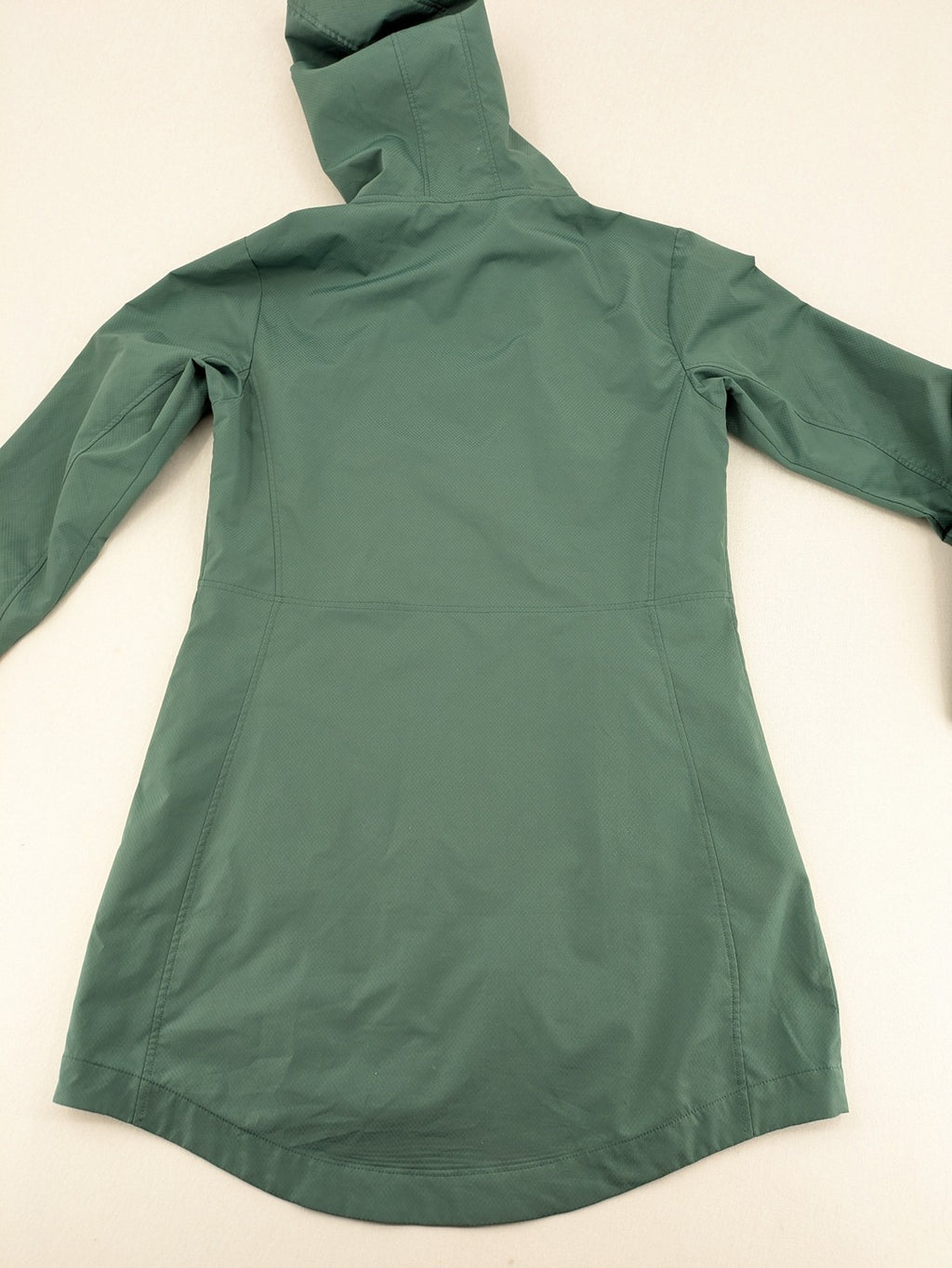 Frilufts green softshell jacket with hood, longline design, durable zipper, practical zip pockets.