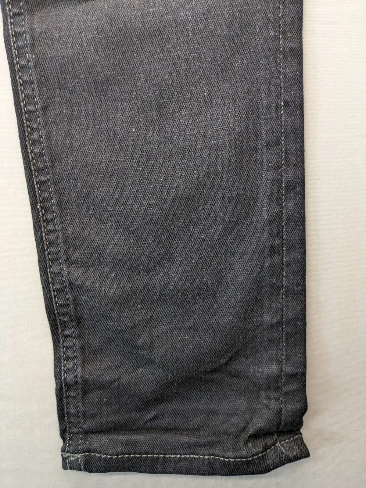 Jack & Jones grey slim fit jeans with classic 5-pocket style and button closure.