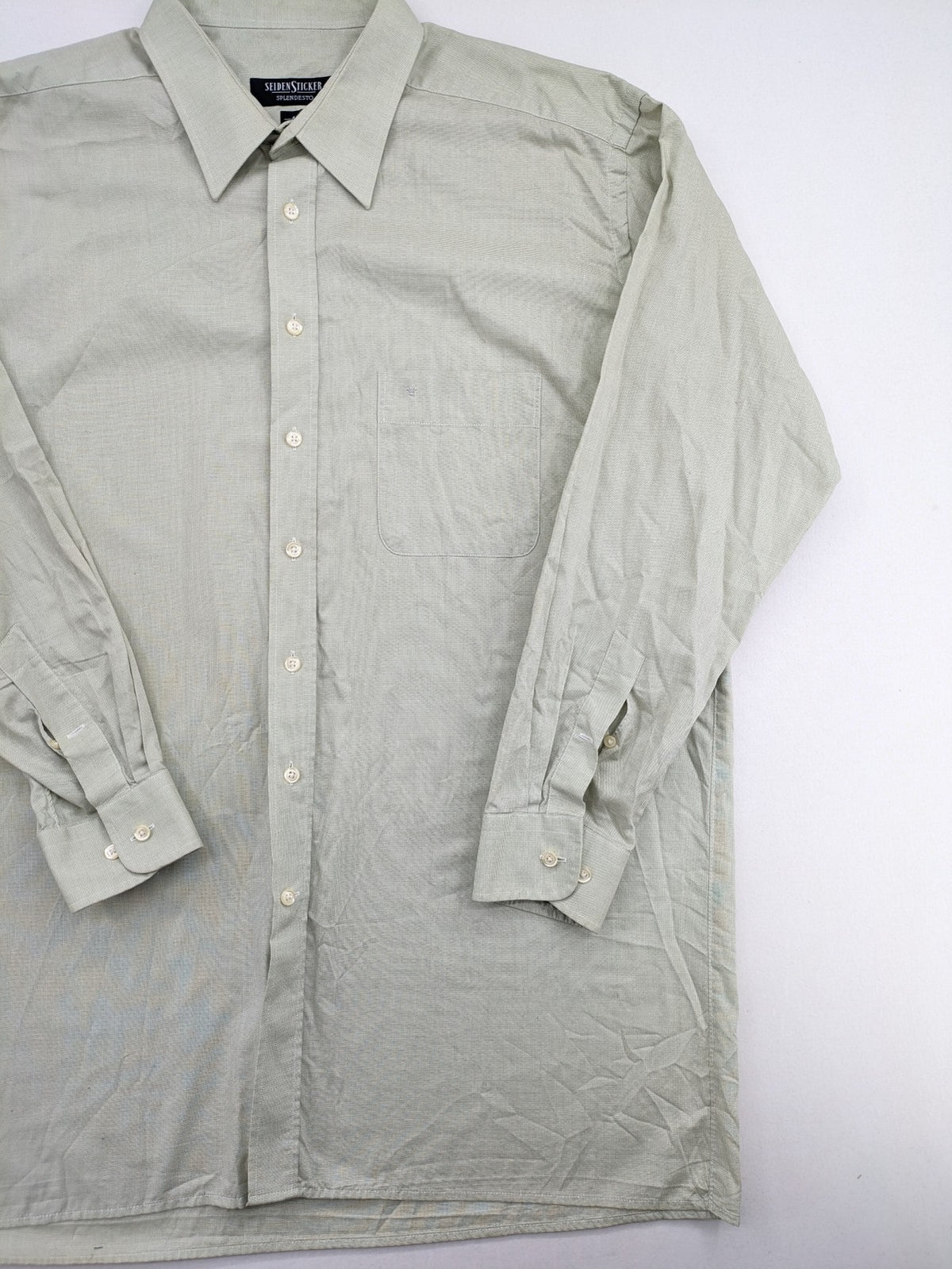 Seidensticker grey button-up shirt with subtle pattern and embroidered logo on pocket.