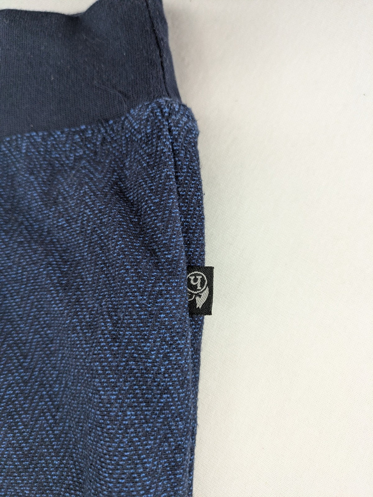 Hajo navy turtle neck jumper with herringbone pattern, zip collar, and chest pocket.