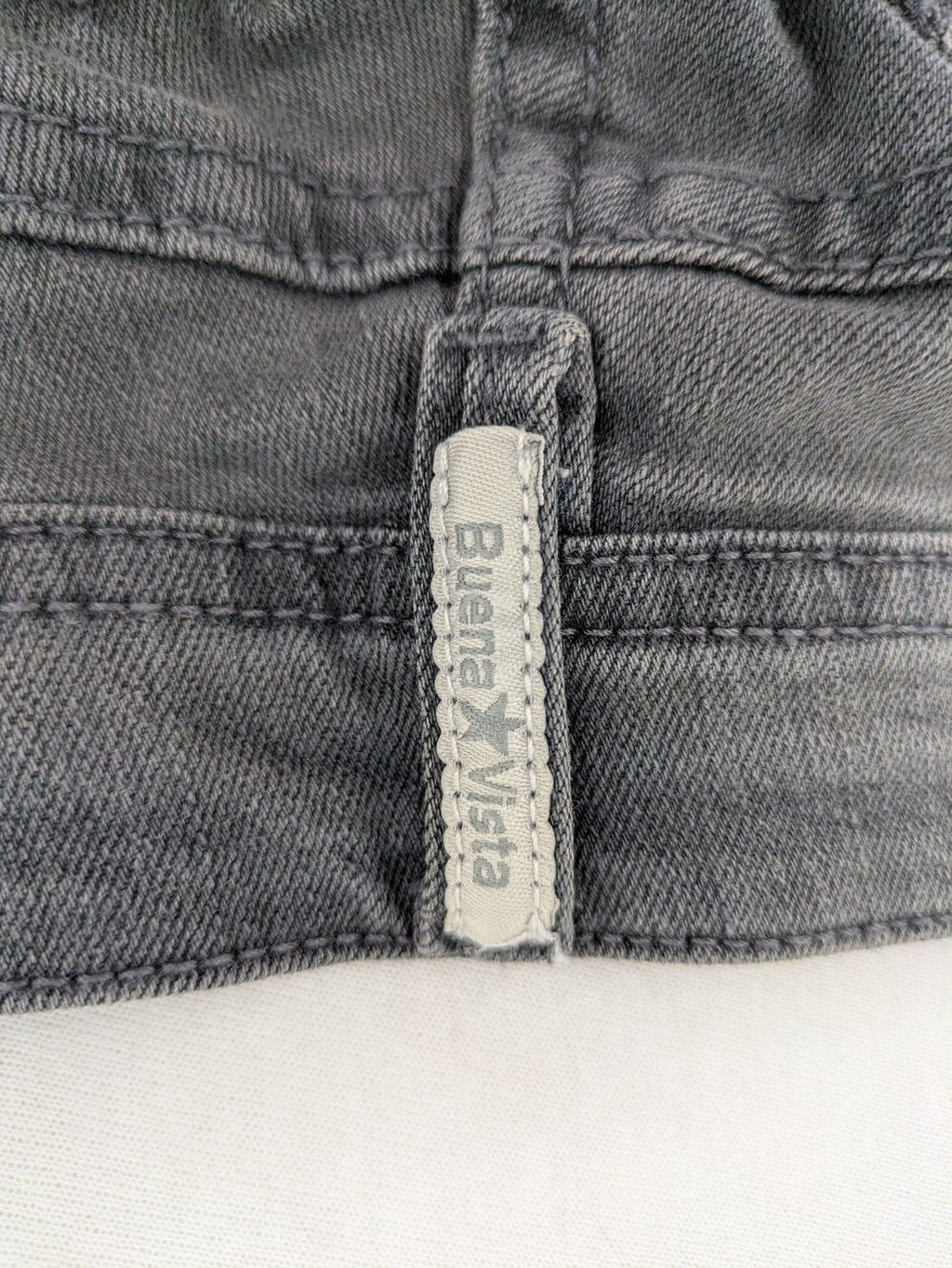 Buena Vista grey skinny jeans with button fly and stretch denim material.