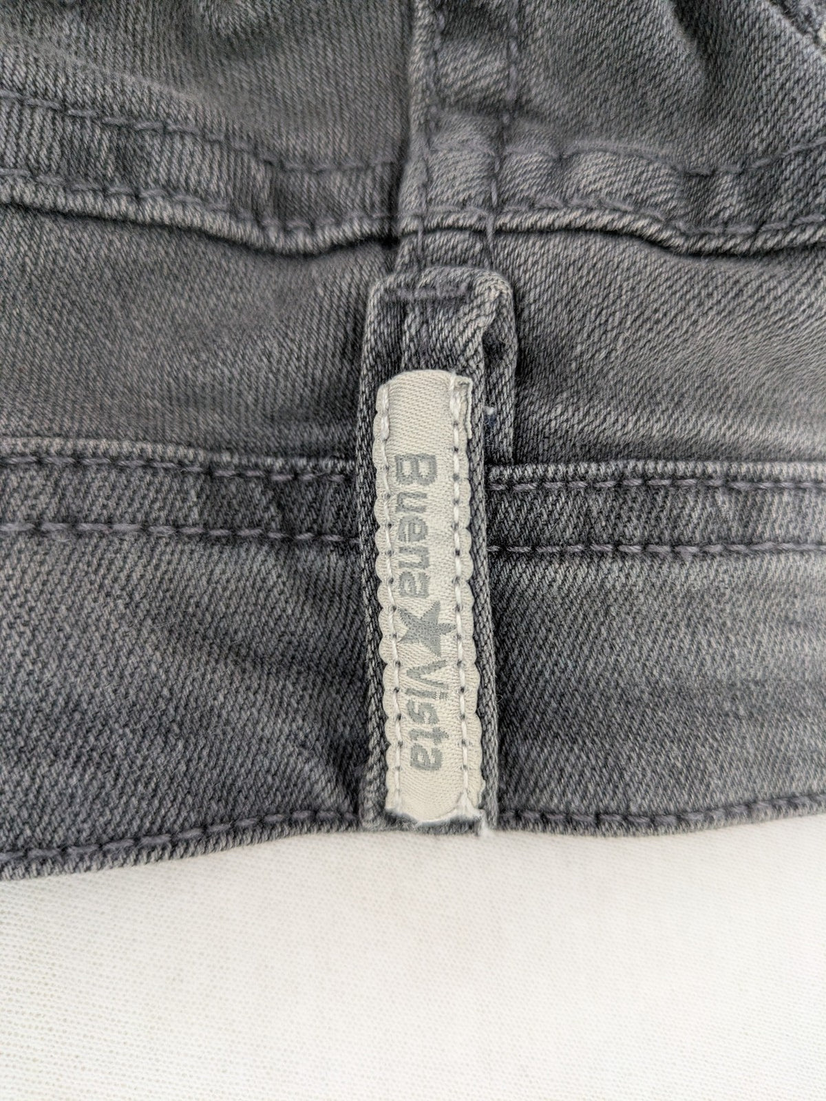 Buena Vista grey skinny jeans with button fly and stretch denim material.