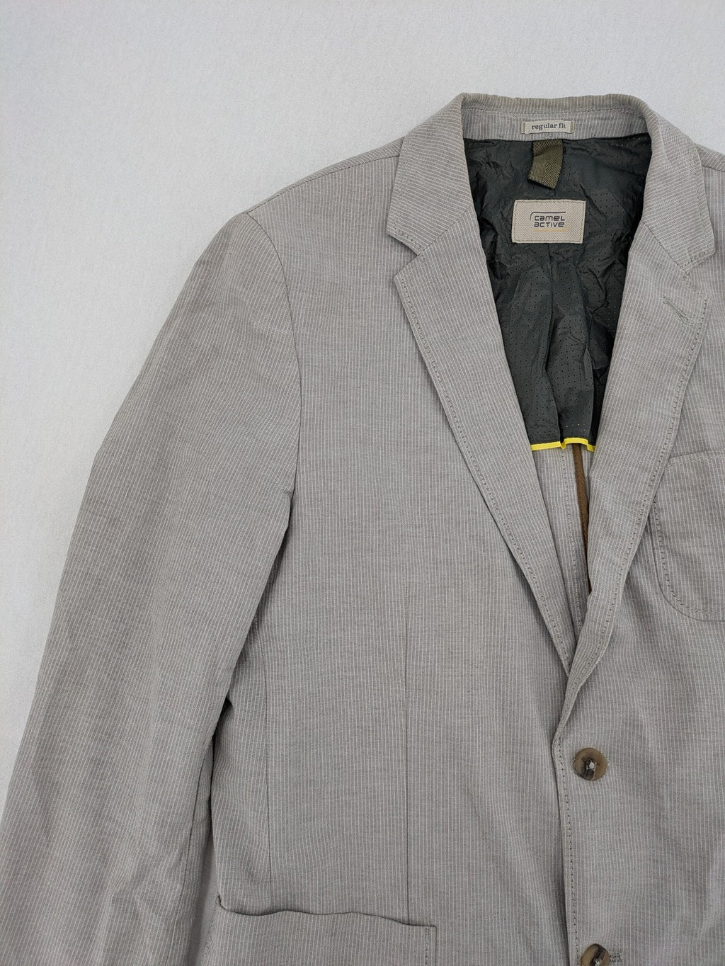 Camel Active grey cord blazer with classic two-button closure and practical zippered inner pockets.