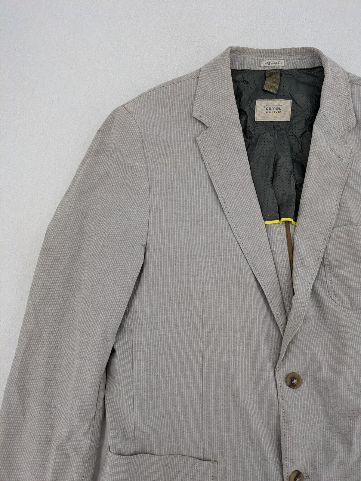 Camel Active grey cord blazer with classic two-button closure and practical zippered inner pockets.