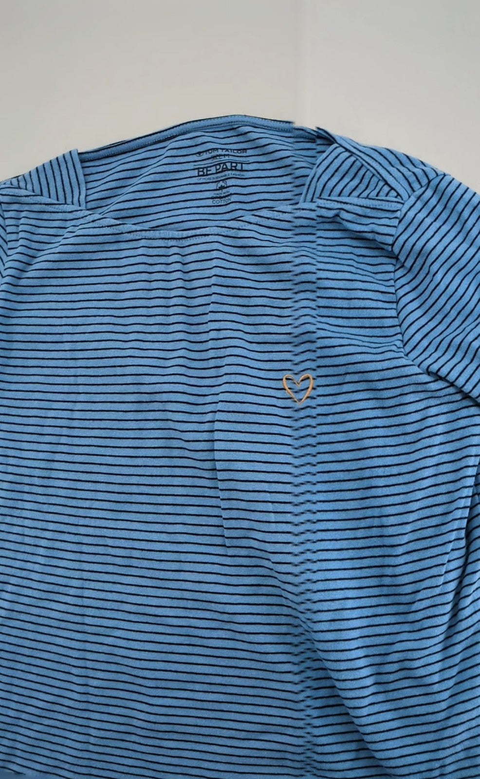 Tom Tailor blue striped top with gold heart emblem, made from organic cotton.