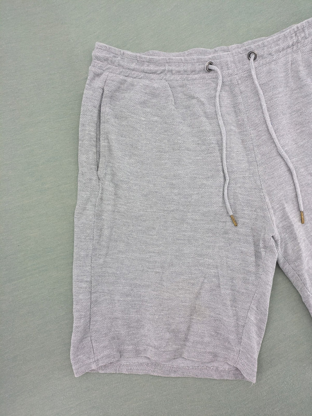 Livergy grey sweat shorts with elastic waistband, drawstring, and side pockets.