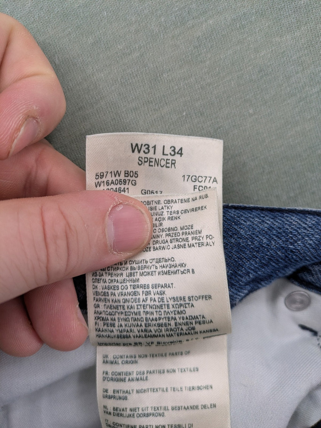 Wrangler blue straight jeans with button fly and classic 5-pocket design.