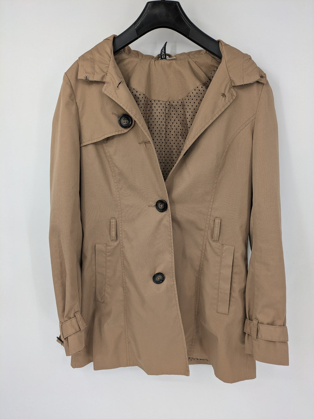 H&M Divided beige trench coat with button closure, hood, and polka dot lining.