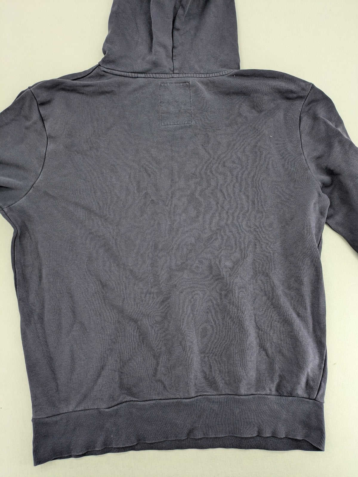 Angelo Litrico grey hoodie with neon green 'Real Goods Co NYC' graphic print and kangaroo pocket.