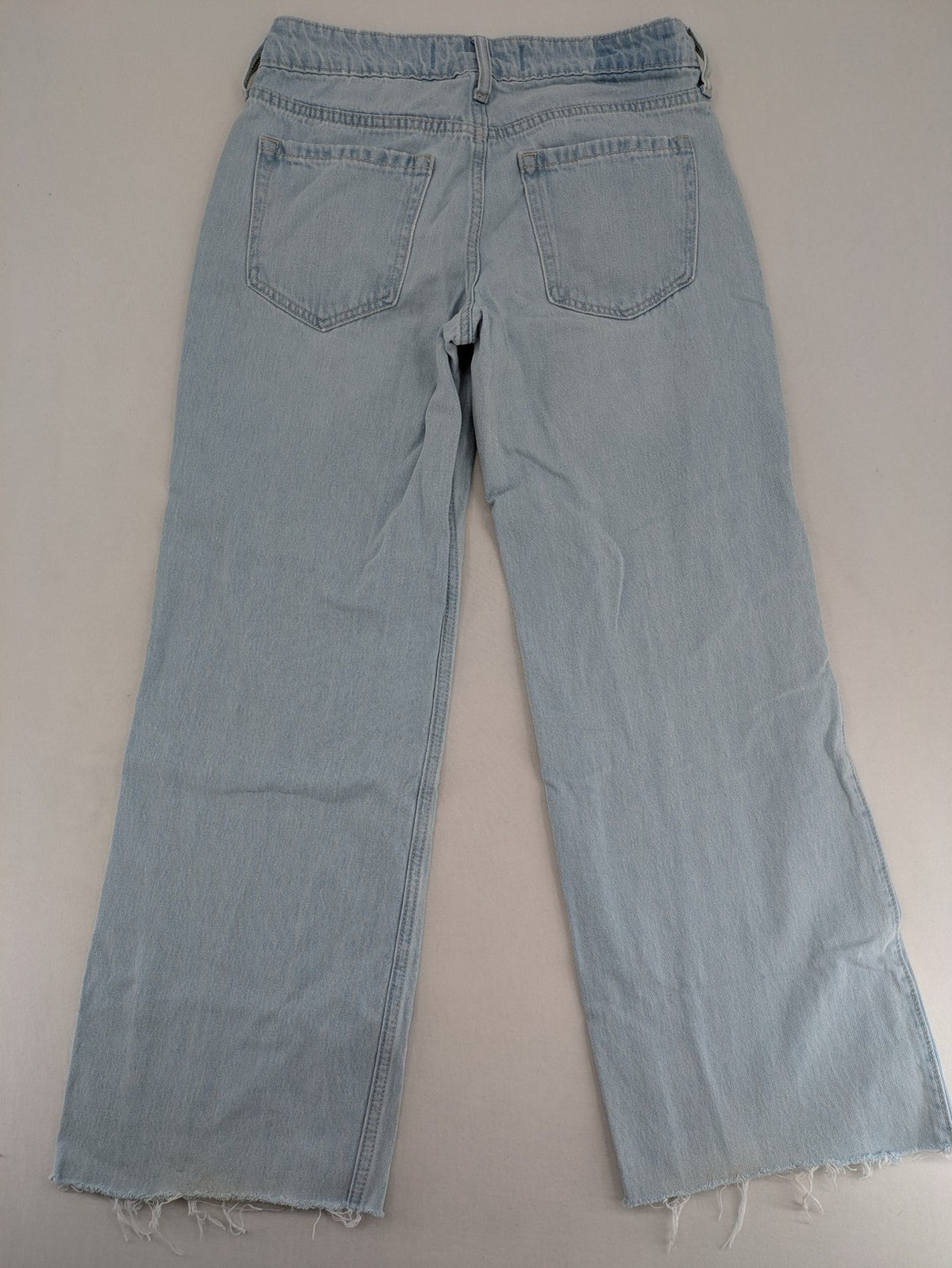 Hollister blue straight jeans low-rise baggy with raw hem and classic five-pocket design.