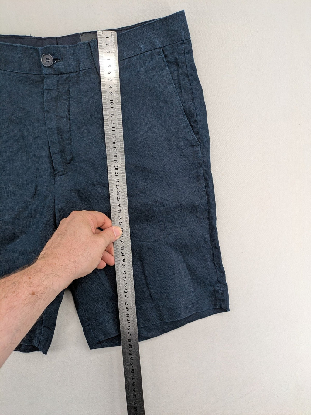 H&M blue linen shorts size 50 flat front design with practical pockets.
