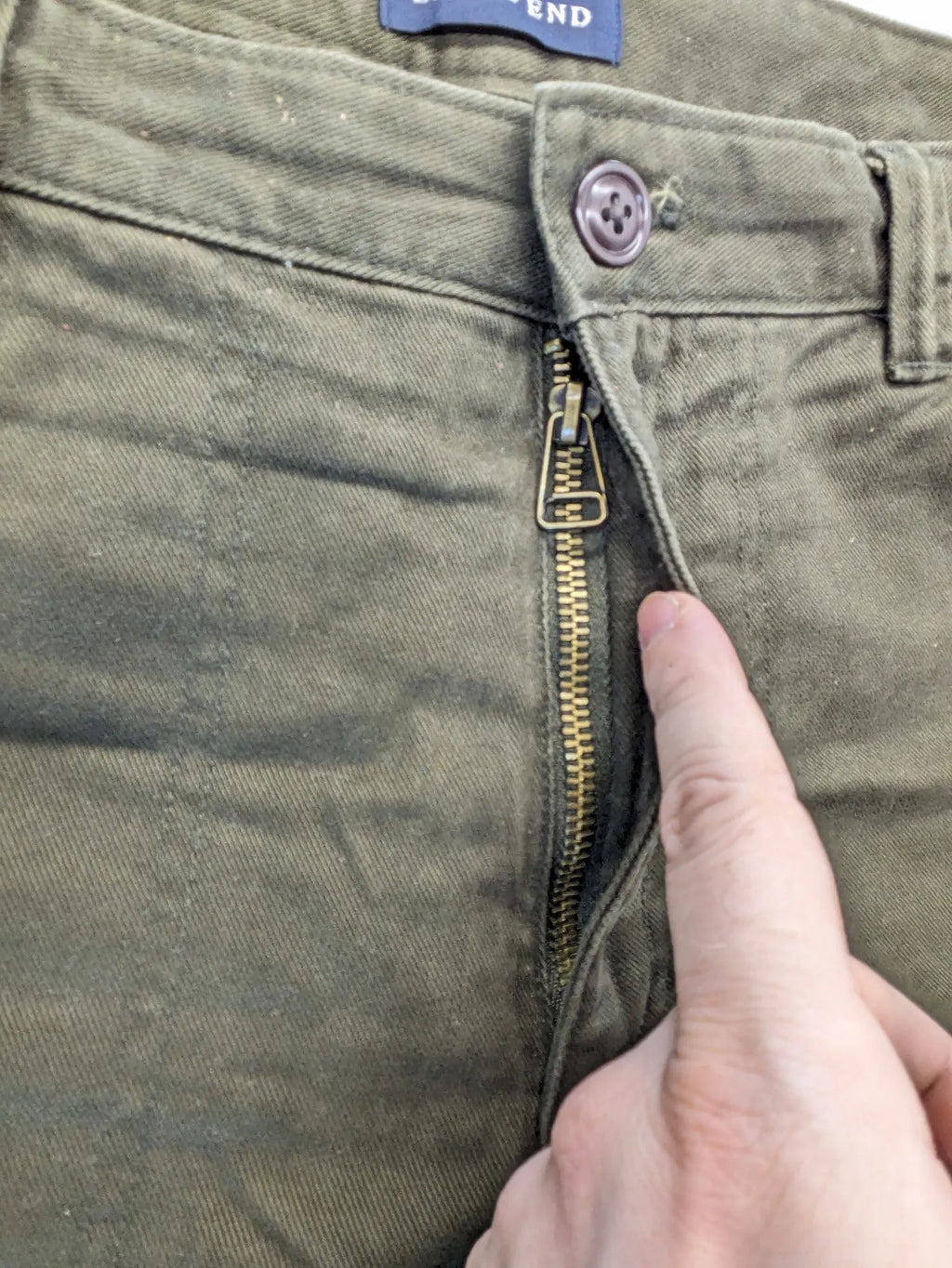 Lands' End green cargo pants with plaid flannel lining and traditional fit design.