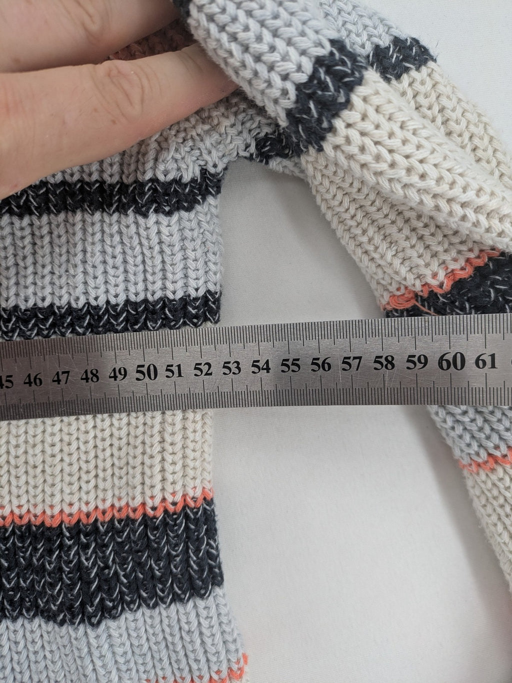 Jonas multi turtle neck jumper with striped pattern and open front design.
