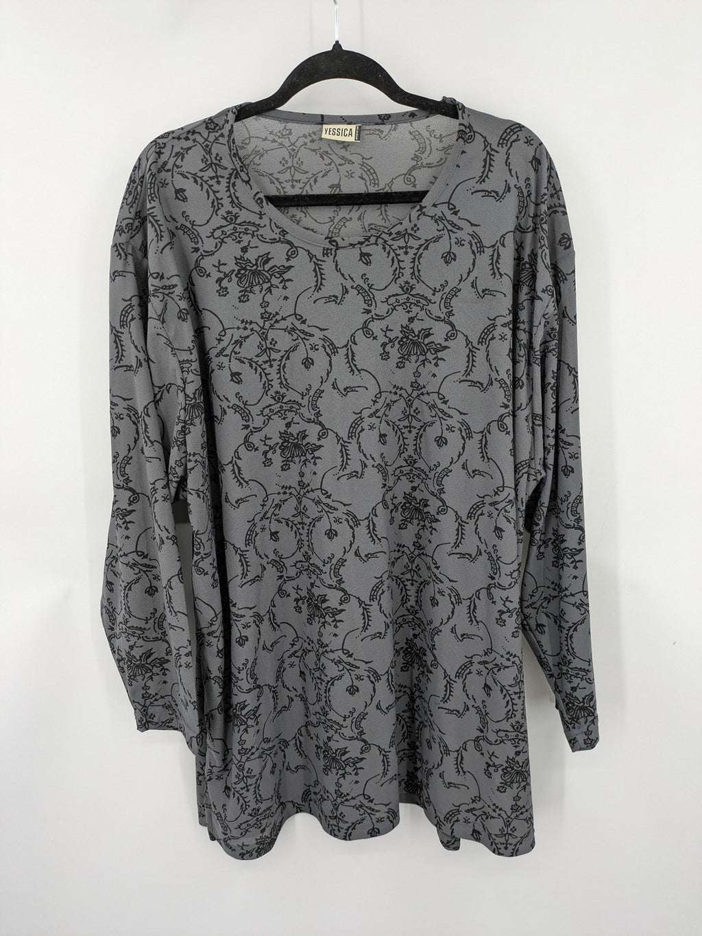 Yessica grey black floral pattern tunic top with round neckline and long sleeves.