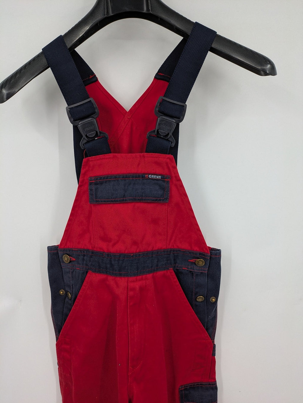 Grene navy red overall with adjustable straps, multiple pockets, and durable material.
