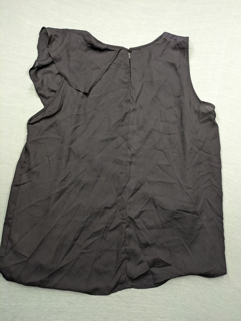 Hayden pink top asymmetrical layered design with ruffle detail, made of 100% polyester.
