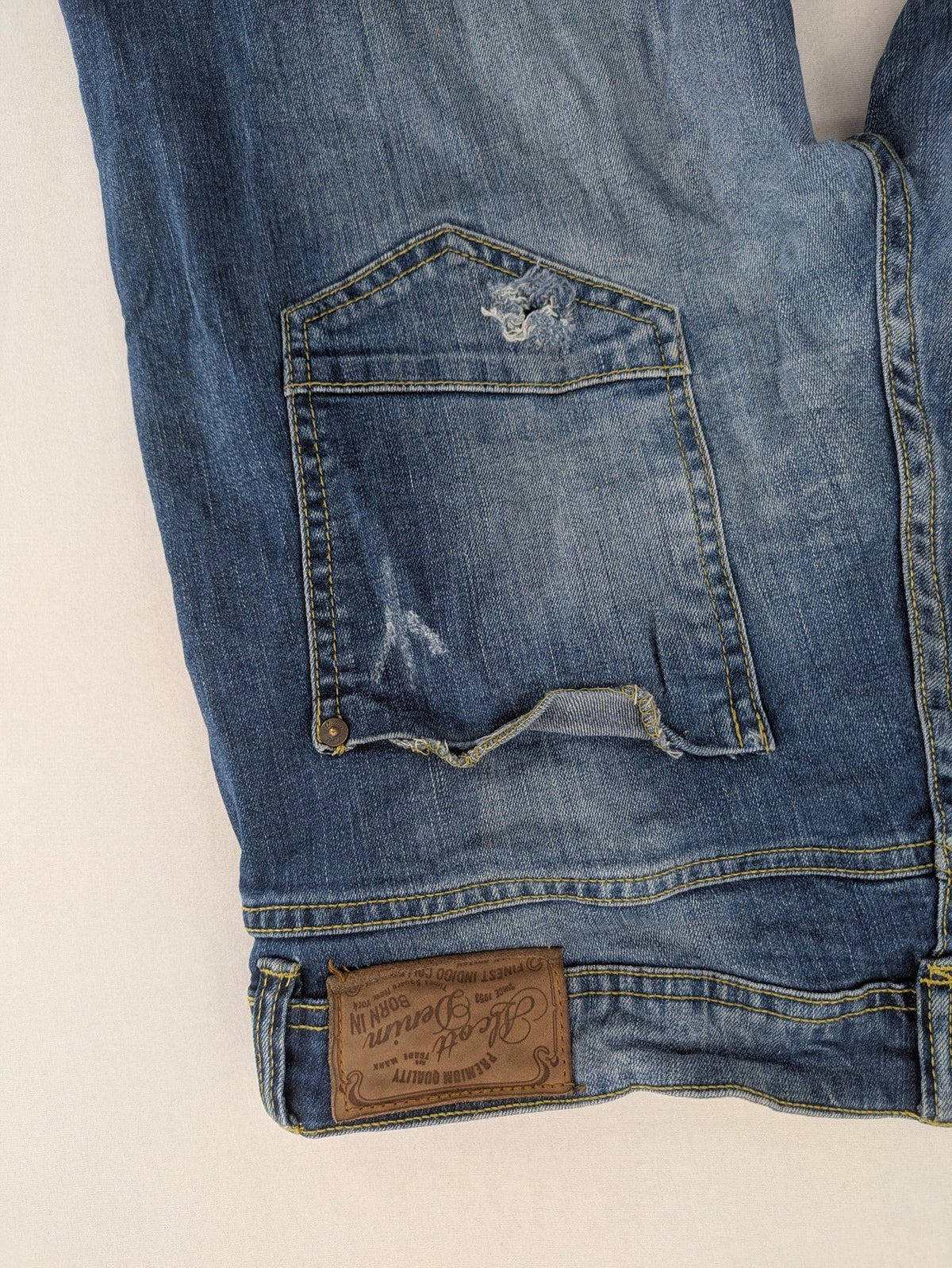 alcott skinny fit jeans blue distressed with button fly and strong wash details