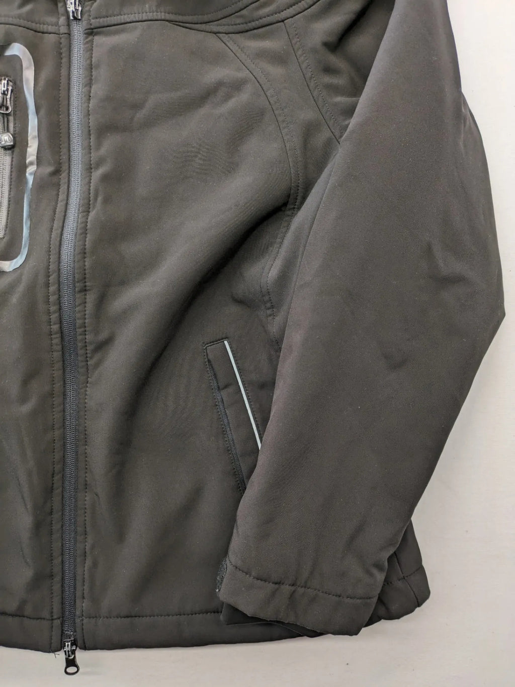 James & Nicholson grey softshell jacket with fleece lining and multiple zip pockets.