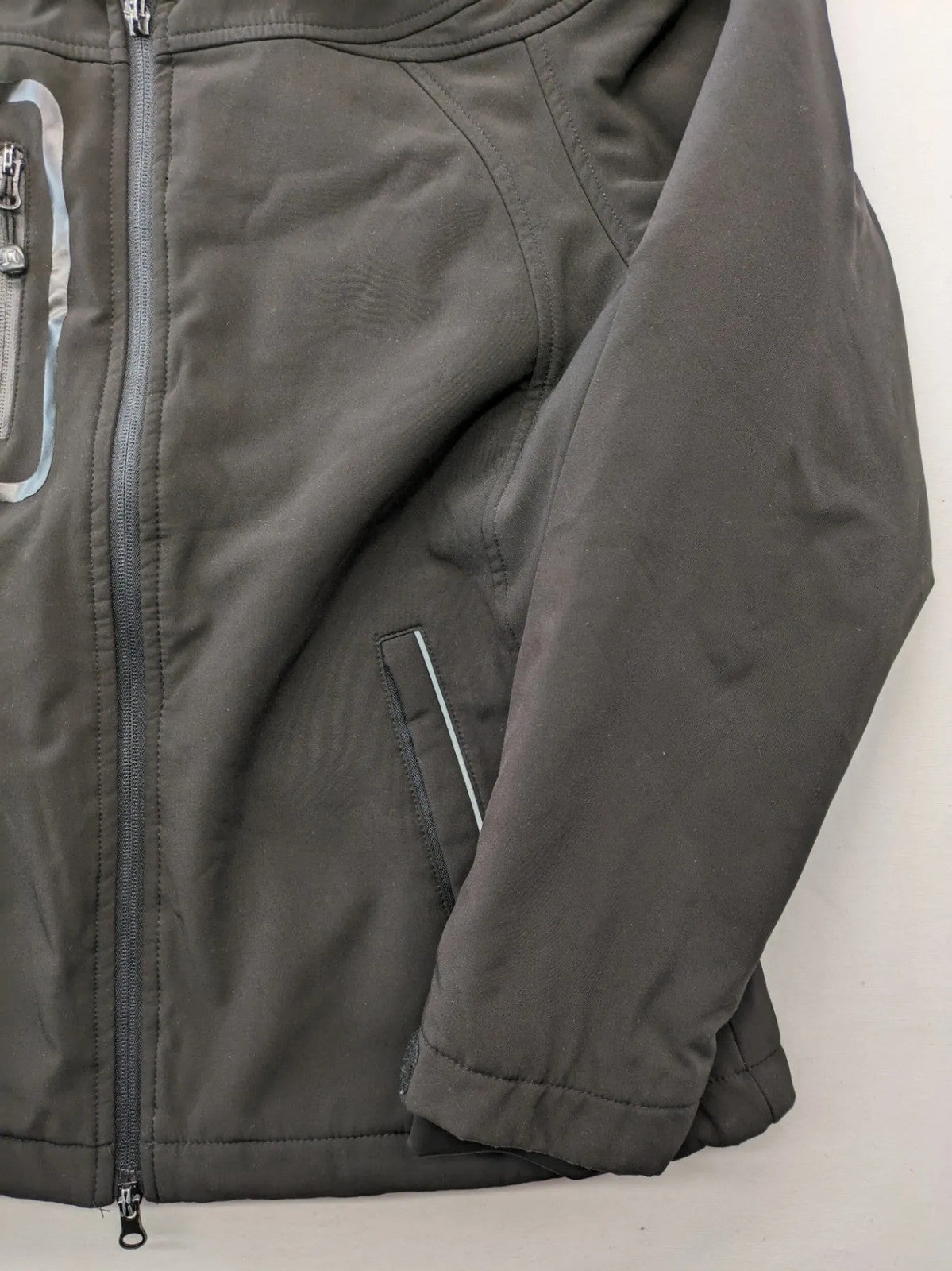 James & Nicholson grey softshell jacket with fleece lining and multiple zip pockets.