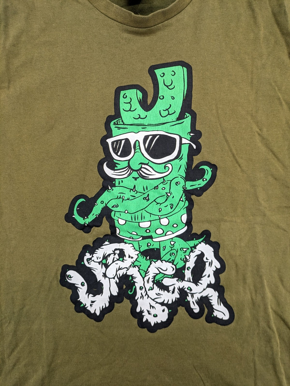 Urgh graphic t-shirt olive green large cactus print front, small logo detail back.