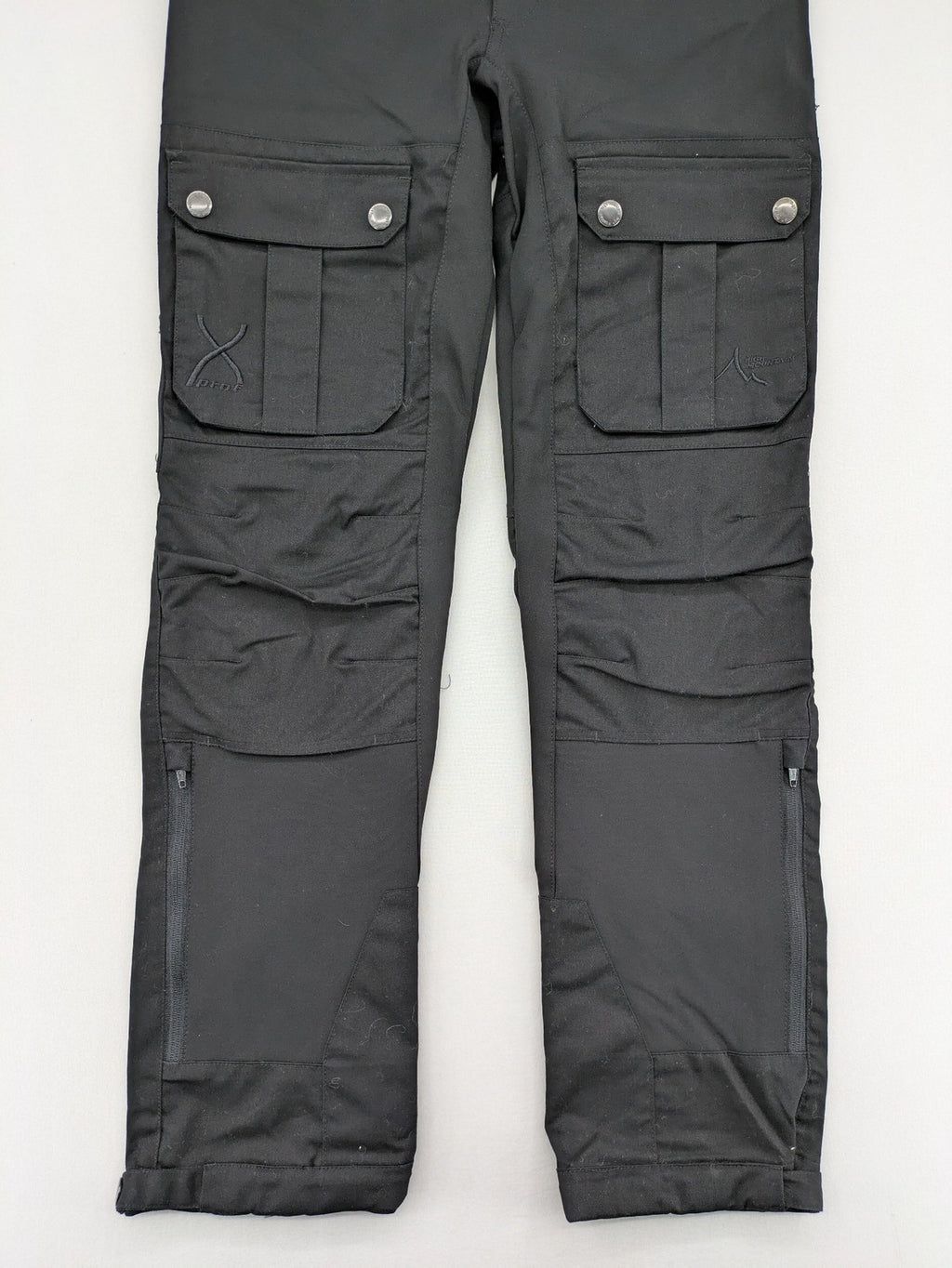 High Mountain black cargo pants with multiple pockets and durable stretch material.