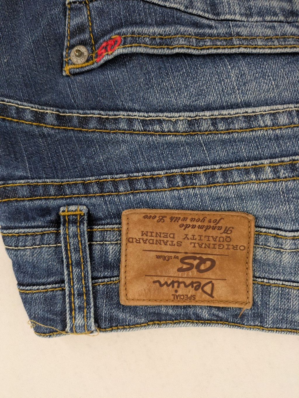 QS by s.Oliver green straight jeans five-pocket design with unique double button closure