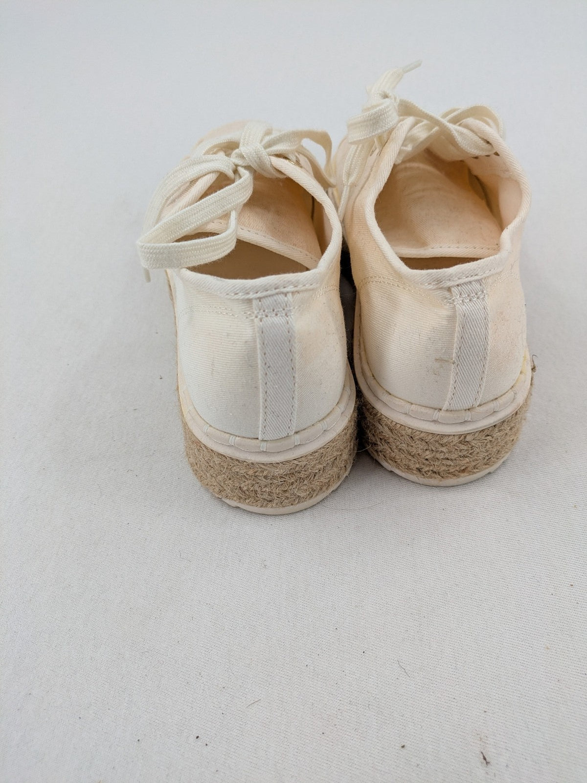 H&M beige espadrille sneakers with jute sole and cream canvas upper.