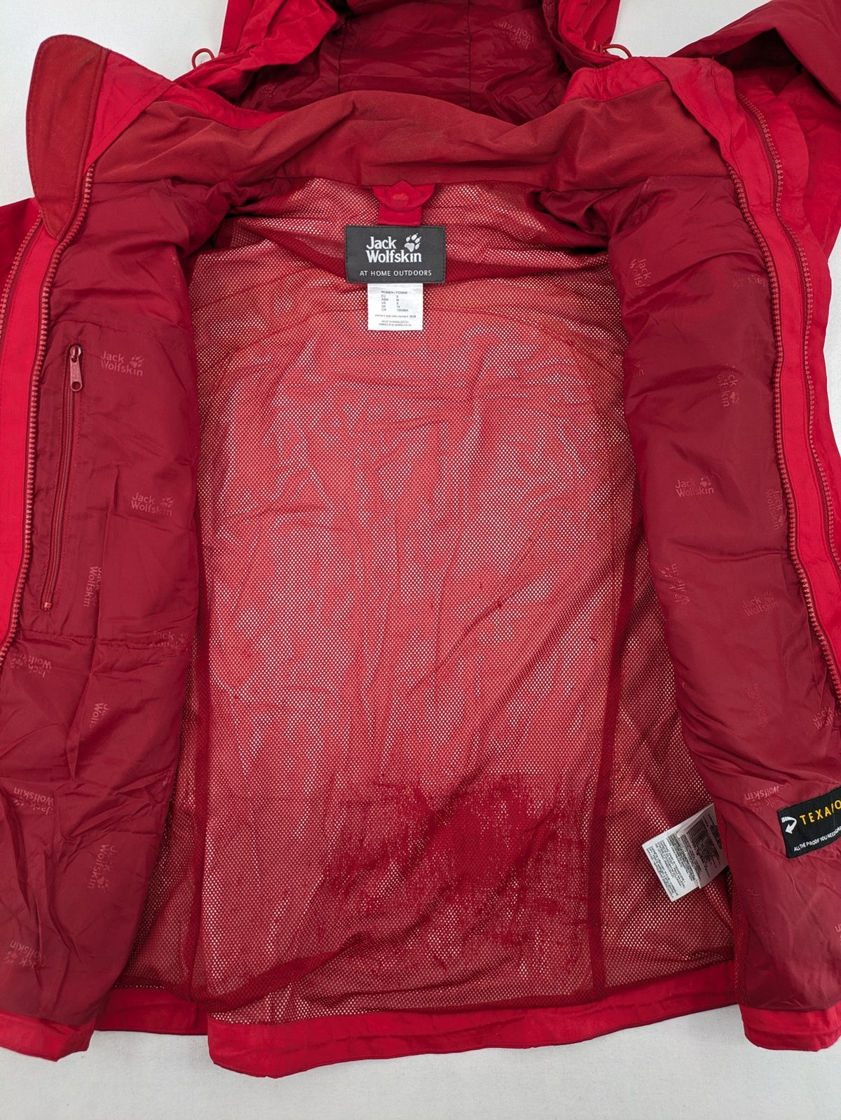 Jack Wolfskin red outdoor jacket with adjustable hood and Texapore waterproof technology