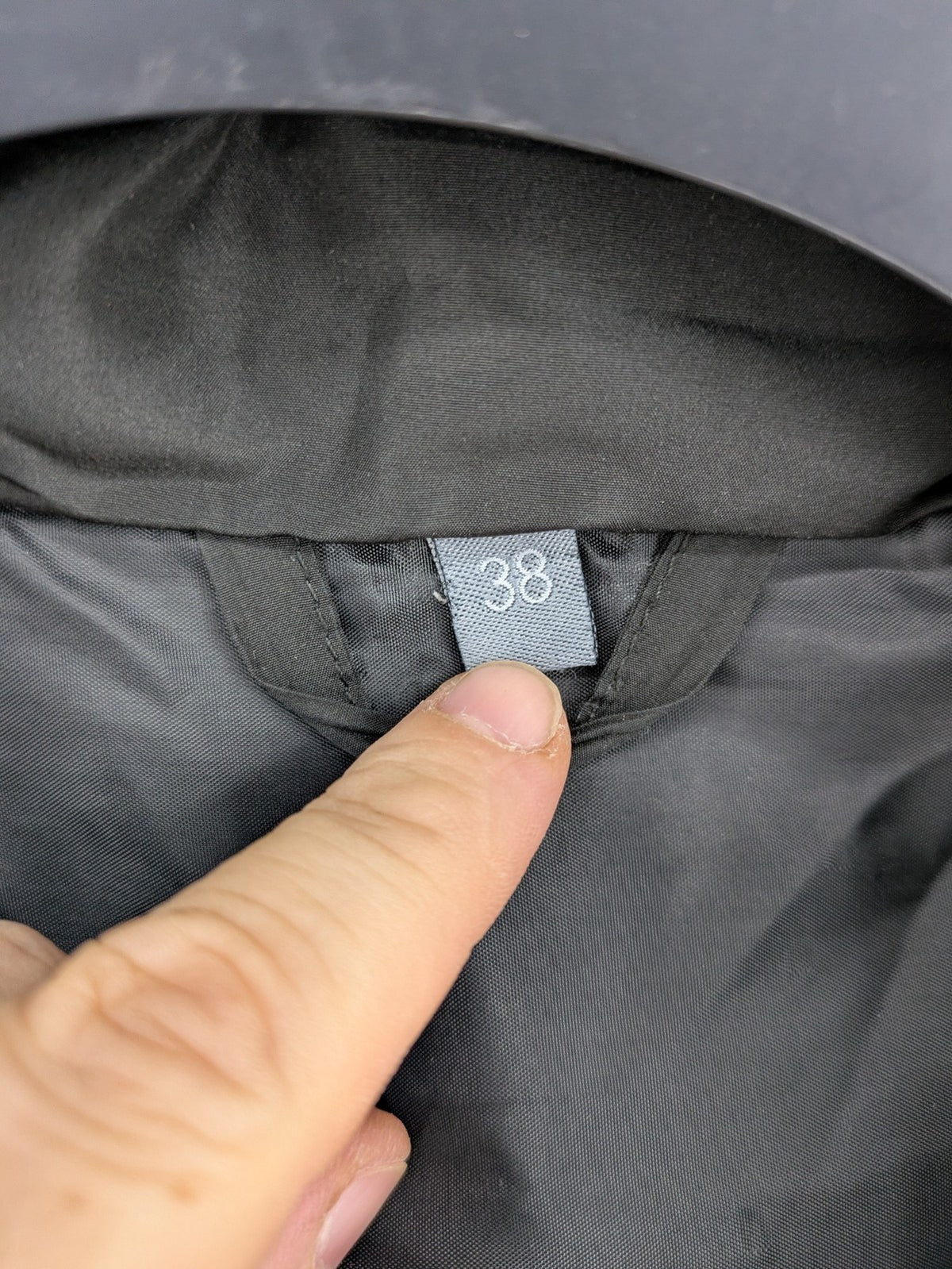 Zeeman grey quilted coat size 38 with hood and side snap buttons.