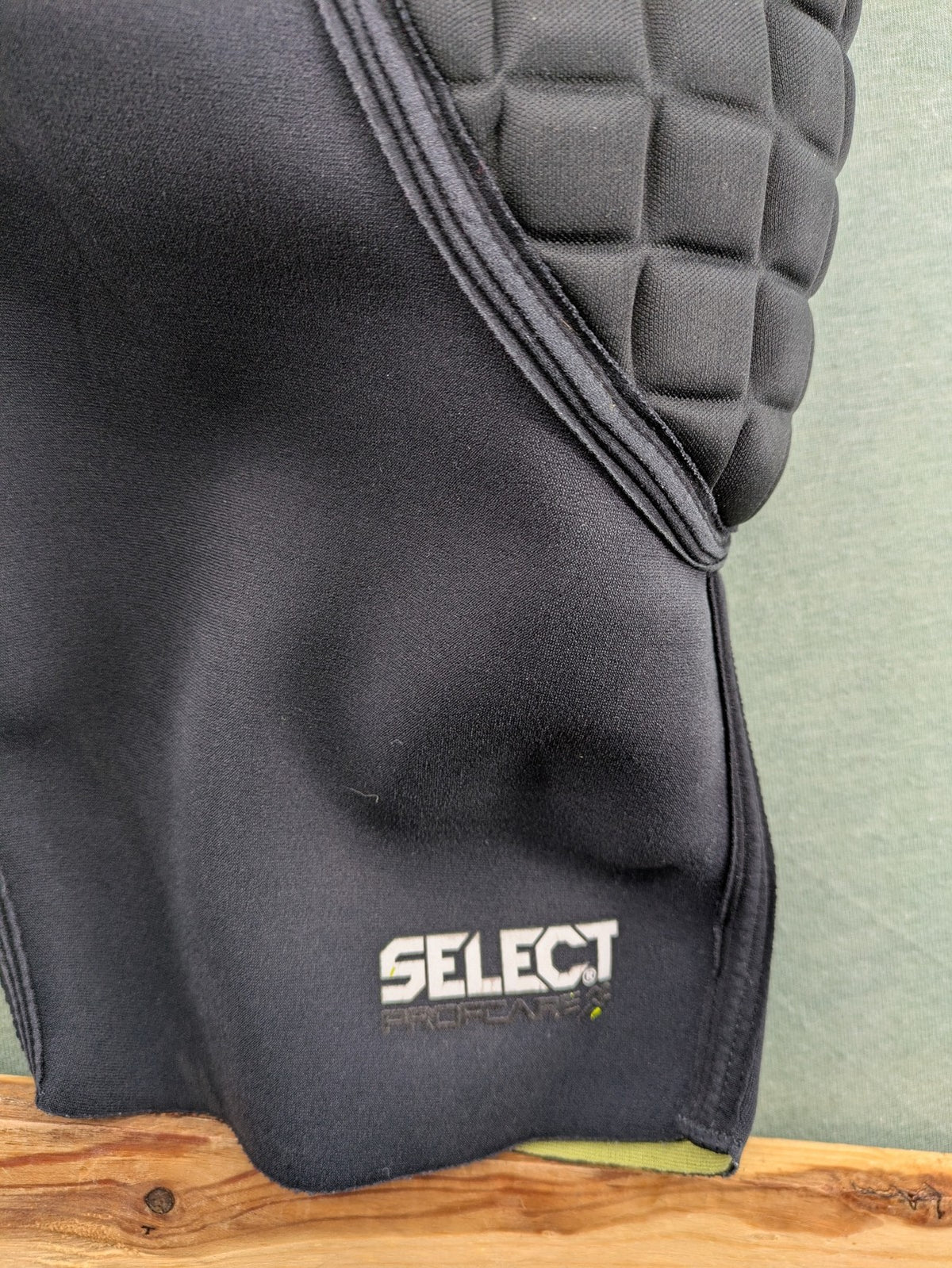 Select padded goalkeeper shorts black with robust hip and tailbone padding.
