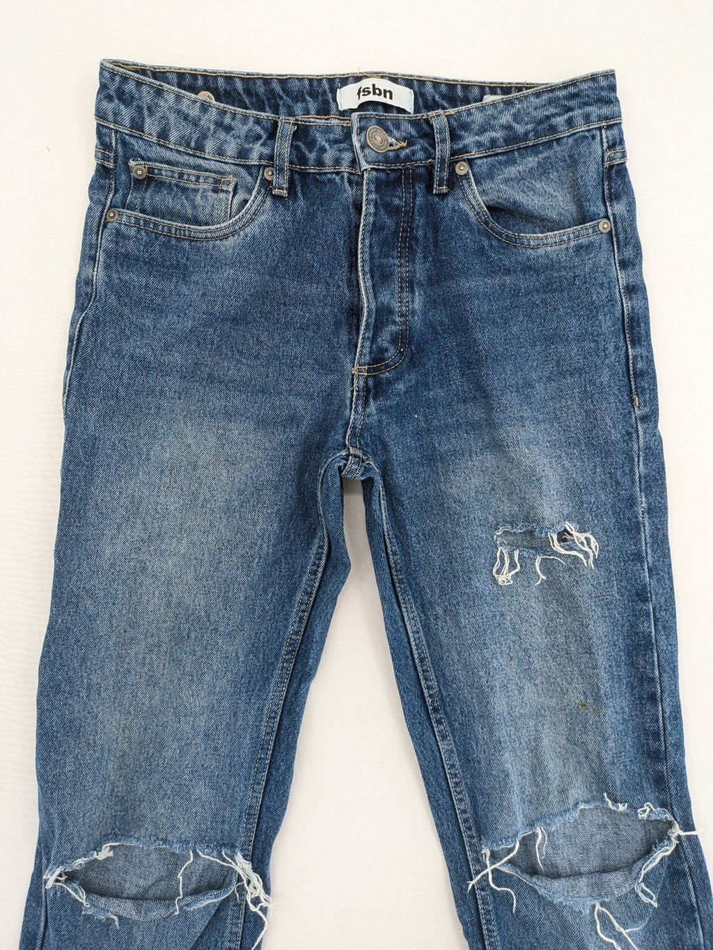 FSBN blue straight jeans with distressed knee rips and classic button fly.