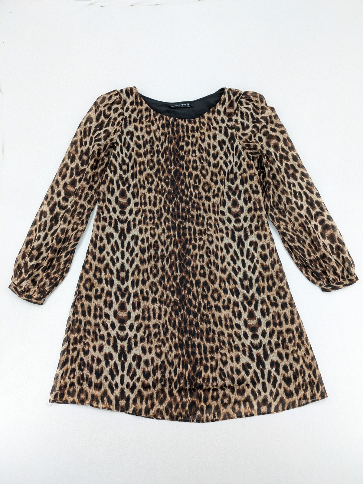 Atmosphere beige leopard print dress with sheer chiffon sleeves and buttoned cuffs.
