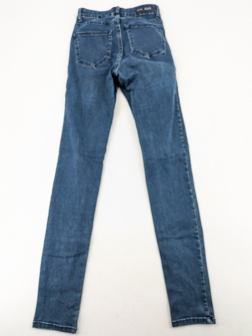 Dust blue skinny jeans with mid-rise waist and classic wash, stretch denim material.