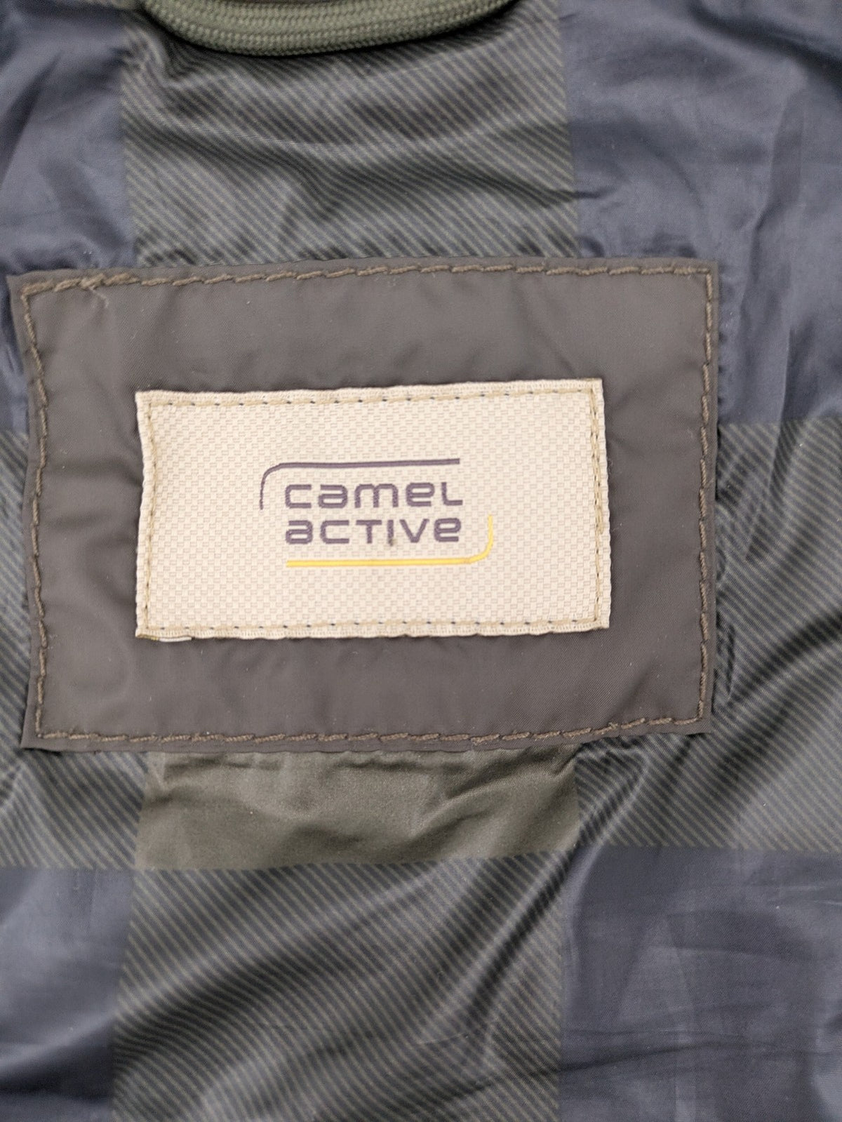 Camel Active khaki vest with full zip, quilted design, checkered lining, water-resistant.
